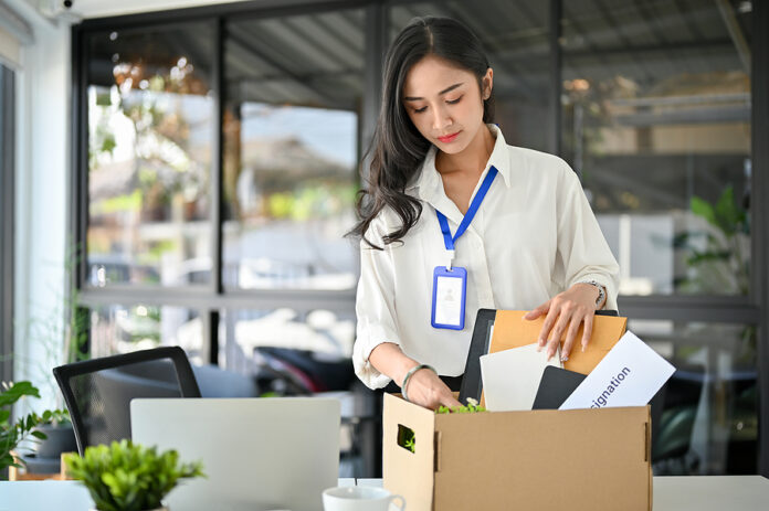 Unhappy Asian Female Office Worker Packing Her Stuff, Quitting H