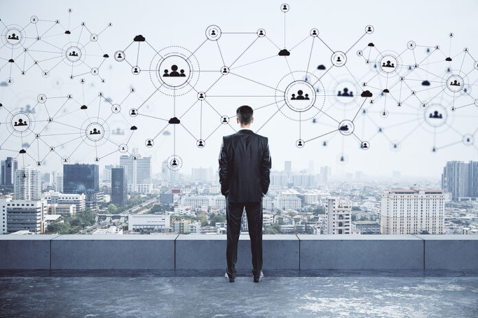 Businessman Standing On Roof