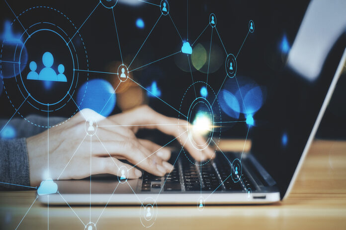 Hand Using Laptop With Social Media Network Interface