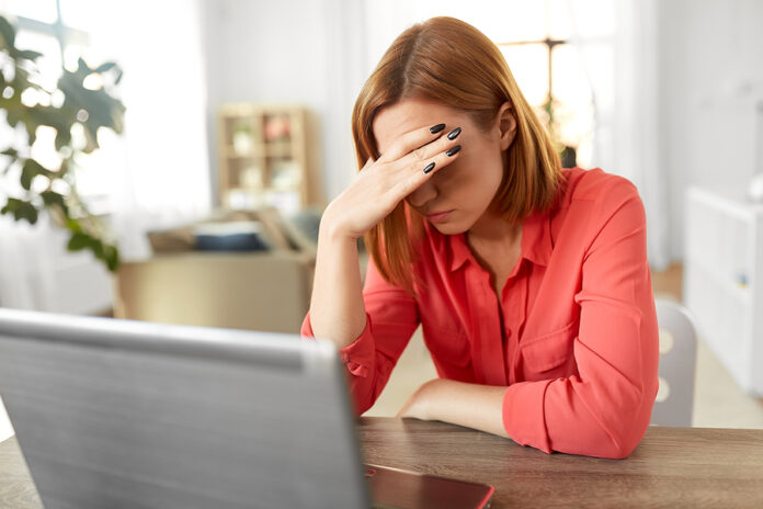 remote job, technology and people concept - tired or stressed yo