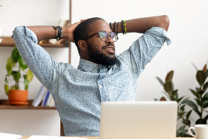 Calm African Businessman Take Break At Workplace Relaxing Finish