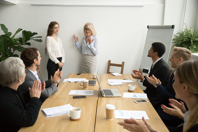 Senior Woman Boss Introducing New Female Worker Making Complimen