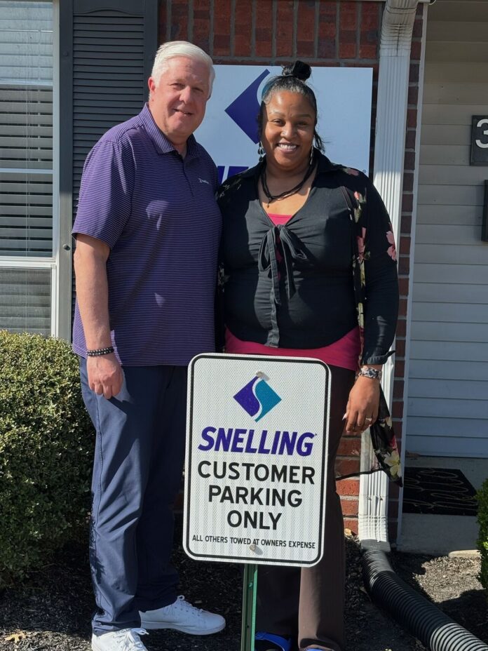 Tim Neilson, Jennifer Collins-Williamson in front of the Jackson Snelling office.